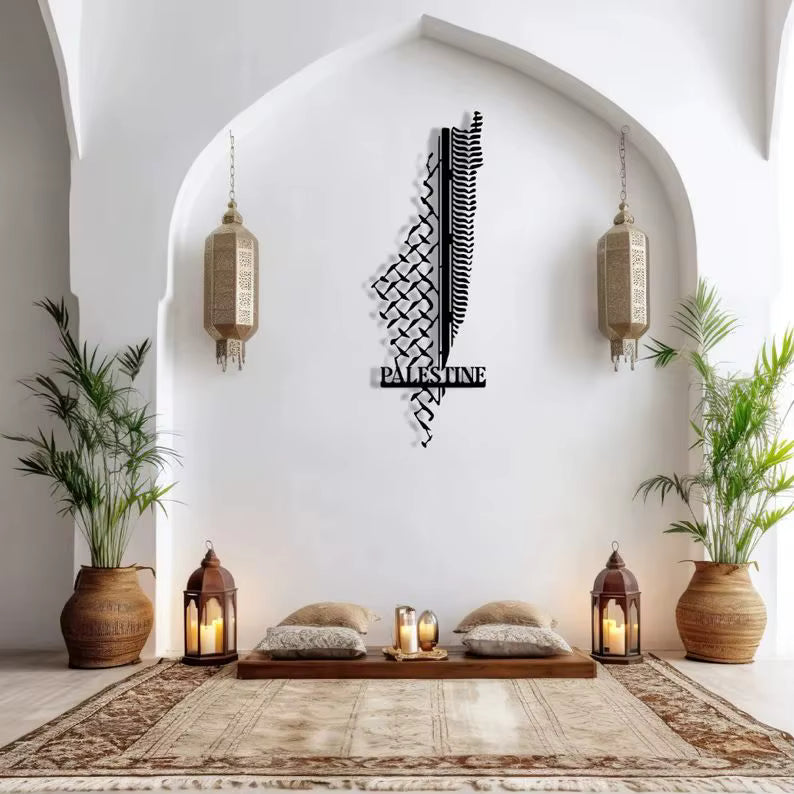 Decorative metal wall art with 'Palestine' on a white wall with lanterns and plants.
