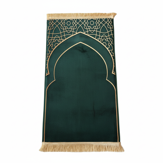 Green prayer mat with gold geometric patterns and fringes on a white background
