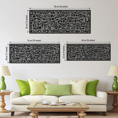 3 sizes of black geometric patterned Islamic wall art kufic calligraphy of Ayatul Kursi on a white wall above a table.