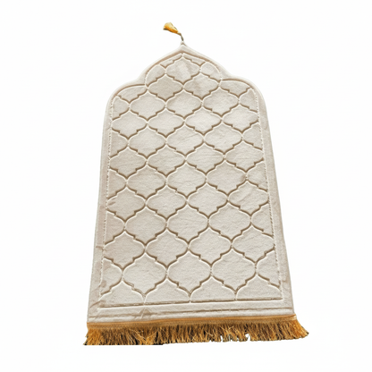White textured prayer mat (rug) with gold geometric pattern and fringes on a white background