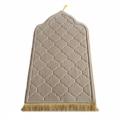 Beige prayer mat with geometric pattern and fringes on a white background