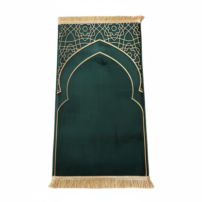 Green prayer mat with gold geometric patterns and fringes on a white background