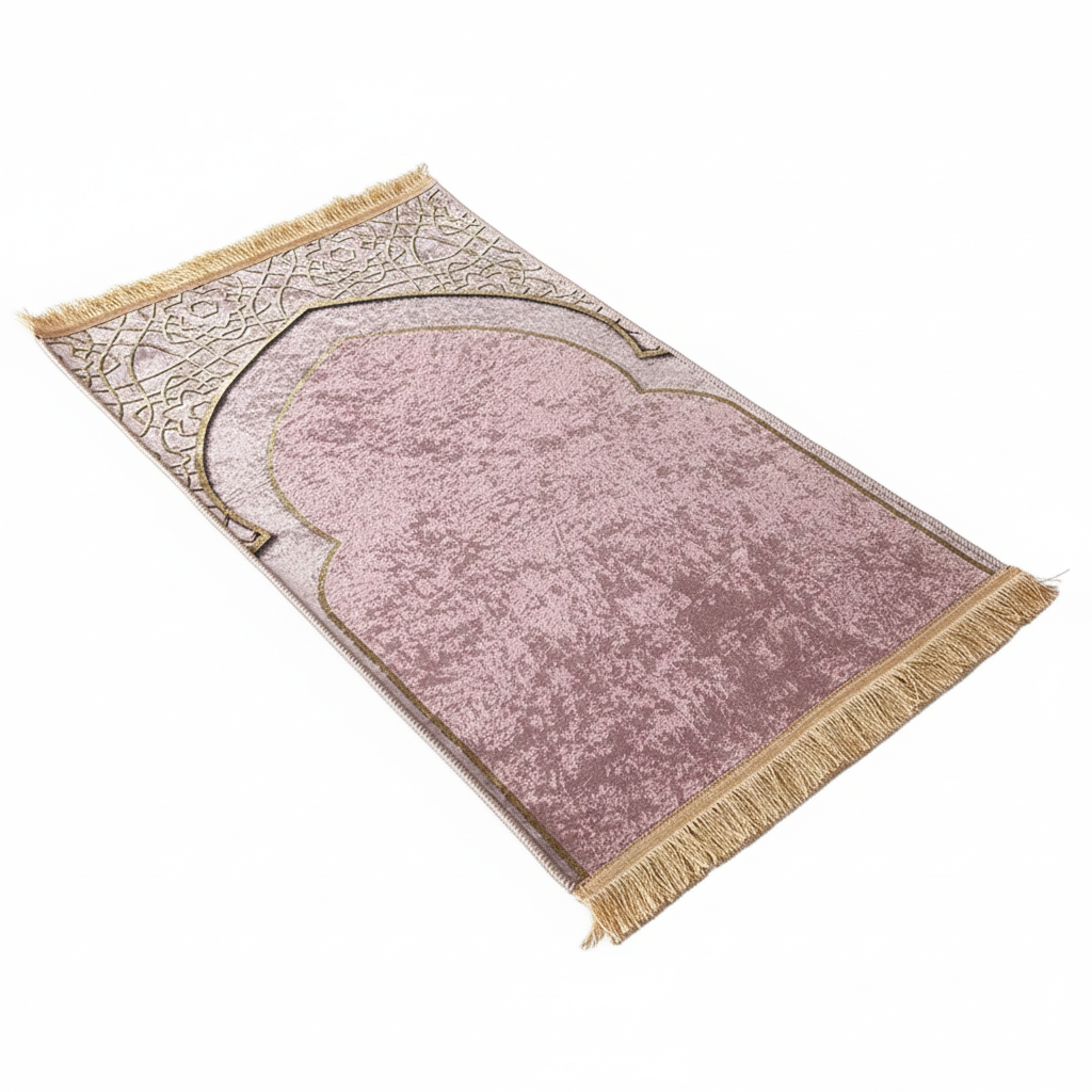 Pink prayer mat with gold border and fringes on a white background